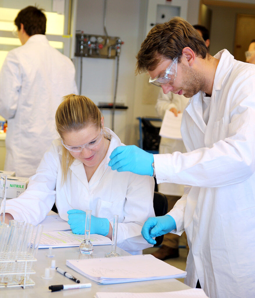 Students conducting chemistry laboratory experiment